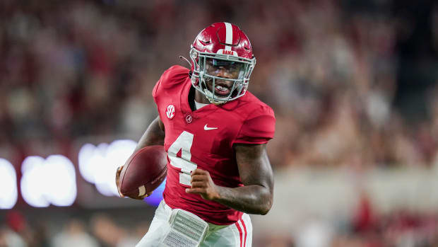 Alabama Crimson Tide quarterback Jalen Milroe (4) carries the ball against the Vanderbilt Commodores during the second half at Bryant-Denny Stadium.